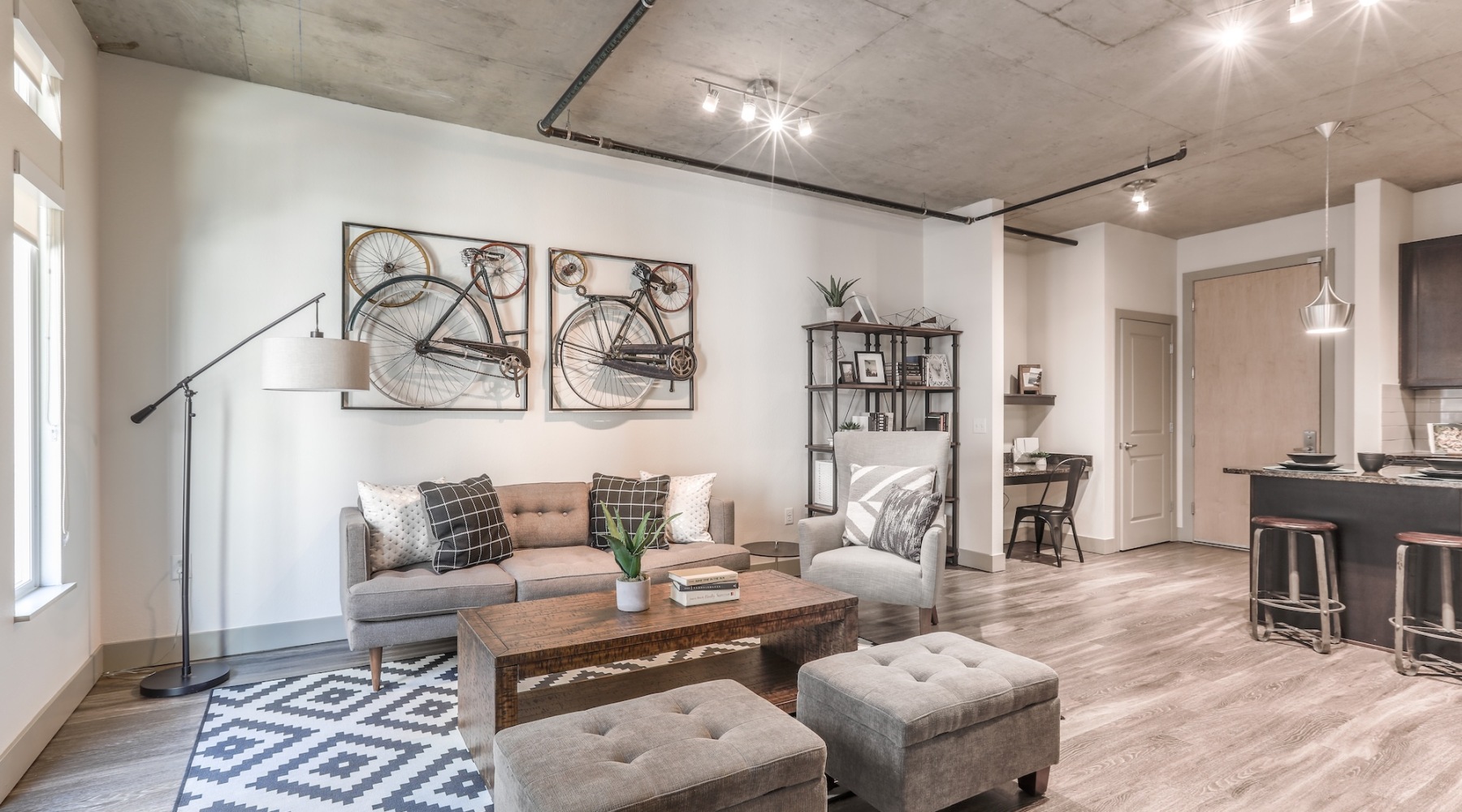 living room with a large window and open spaces