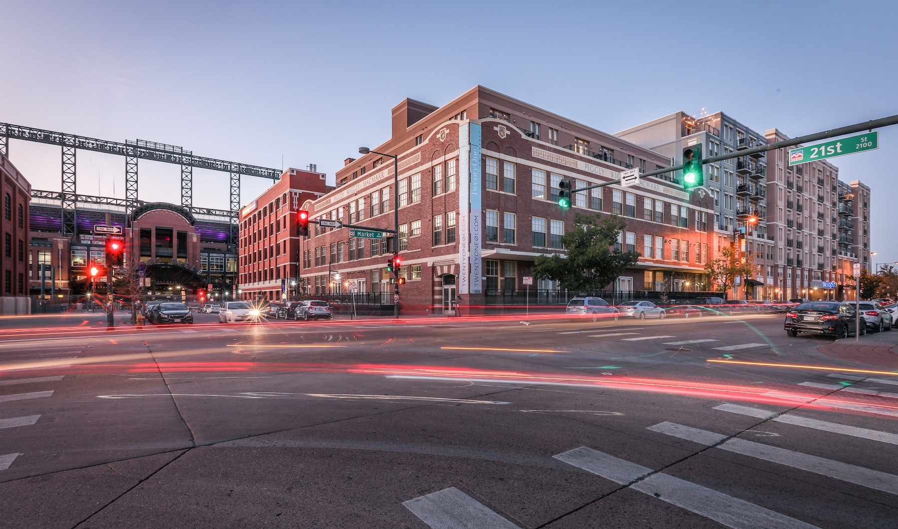 a building with a street and cars in front