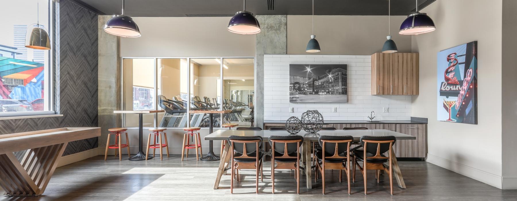 a room with a bar and chairs