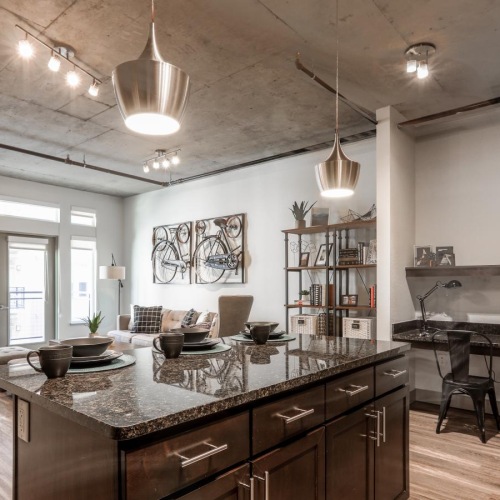 a kitchen with a marble island