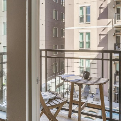 a table and chairs on a balcony